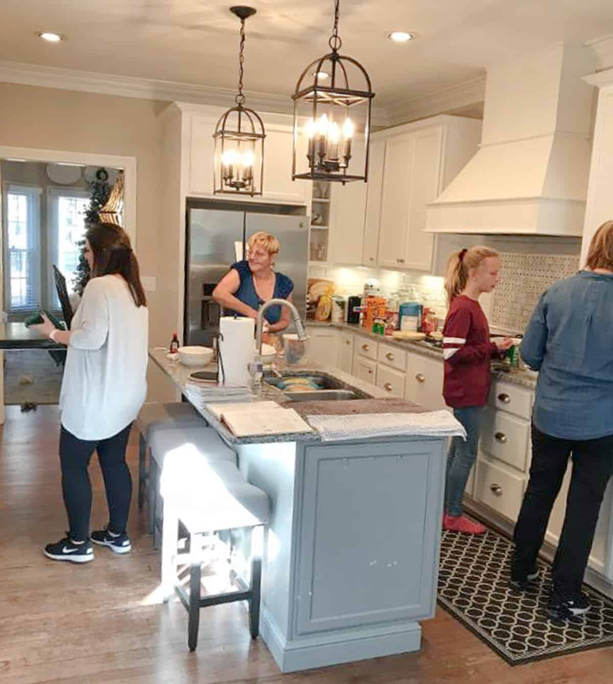 4 women in a kitchen cooking Thanksgiving dinner