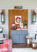 hot chocolate bar set up on a screen porch on a gray chest