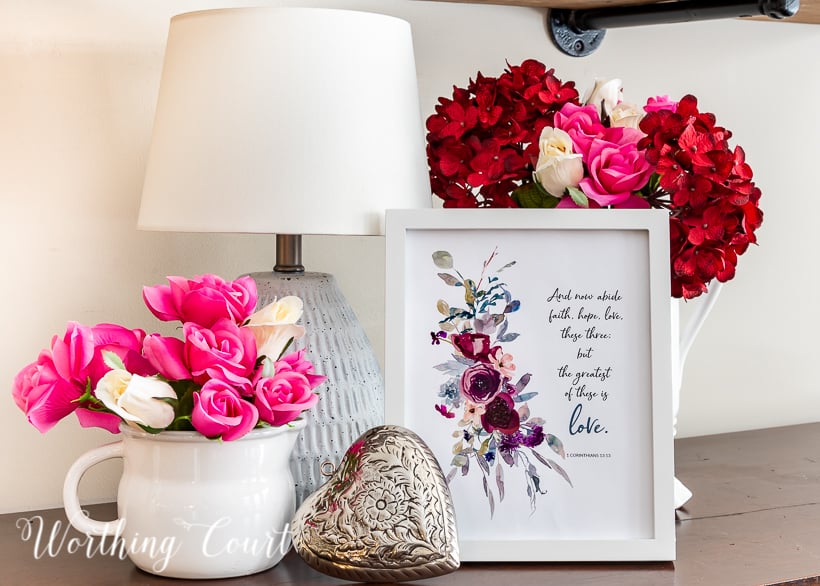 I've mentioned before that I don't do a lot of decorating for the annual day of love, so to keep it simple I created a little Valentine'ish vignette on the sideboard in my kitchen. It's located in a very visible spot, so the printable, combined with a few faux florals, adds just the right bit of a romantic touch.