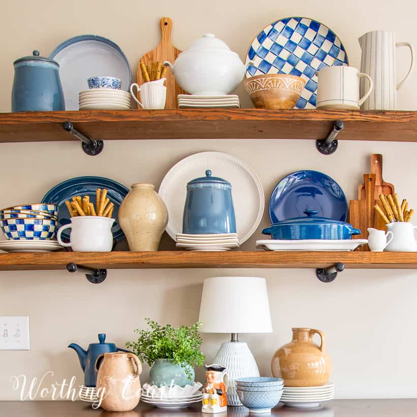 open wood shelves decorated with blue and white accessories
