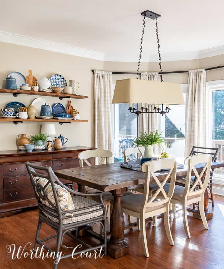 breakfast room and open shelves decorated for spring with blue and white