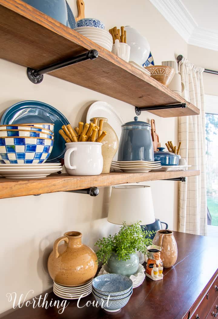 open wood shelves with blue and white accessories
