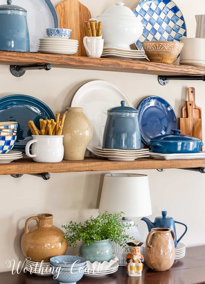 open wood shelves with blue and white accessories