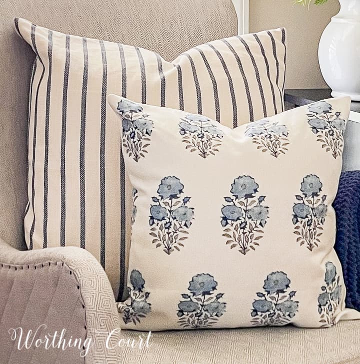 blue and white pillows in a gray chair