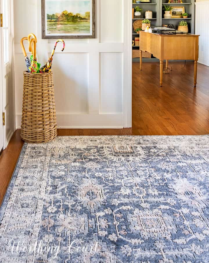 BLUE AND NEUTRAL AREA RUG ON HARDWOOD FLOOR