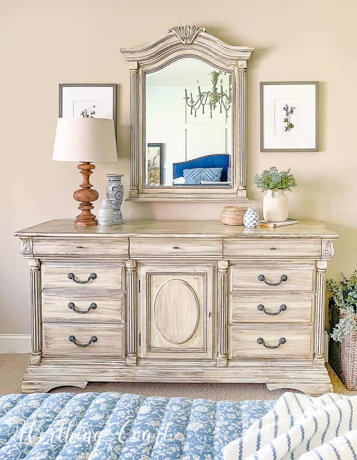 white chest of drawers and mirror with blue and white accessories