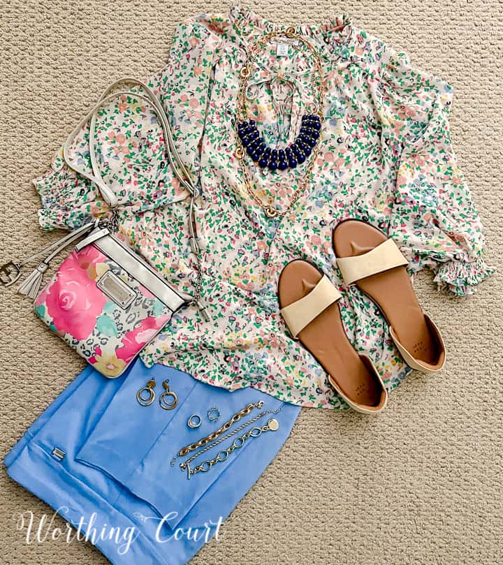 outfit with floral blouse and blue pants