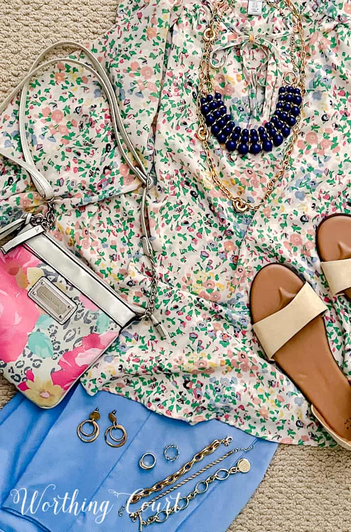 outfit with floral blouse and blue pants