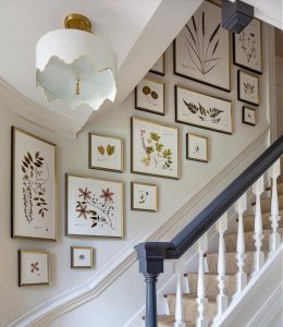 gallery wall in a stairwell and landing area