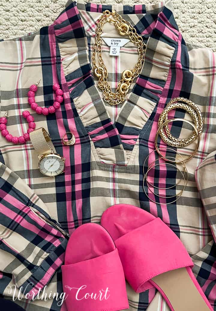 ladies plaid top with gold and pink jewelry and pink sandals