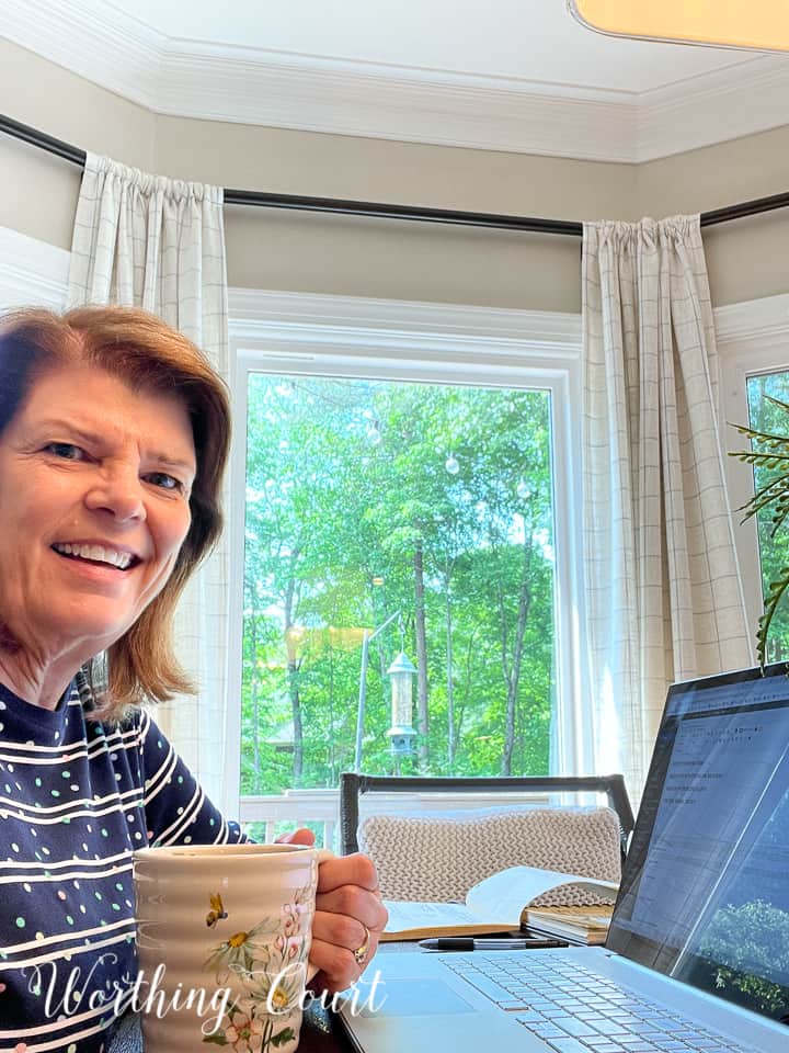 woman sitting at table with laptop