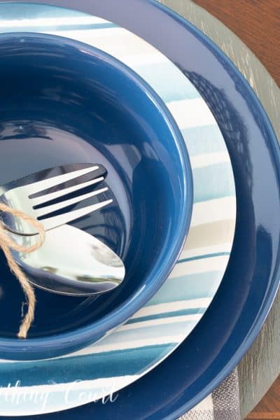 place setting with blue, white and gray plates