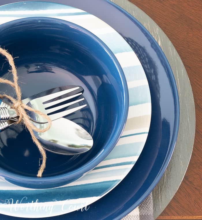 place setting with blue, white and gray plates
