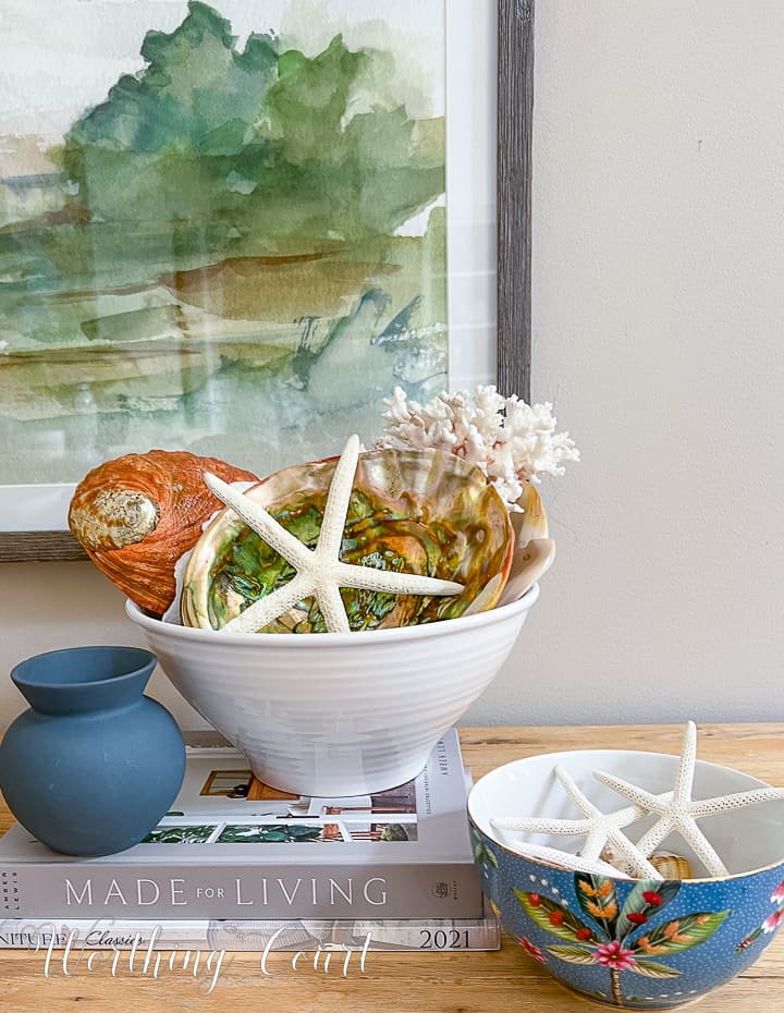 white bowl filled with seashells