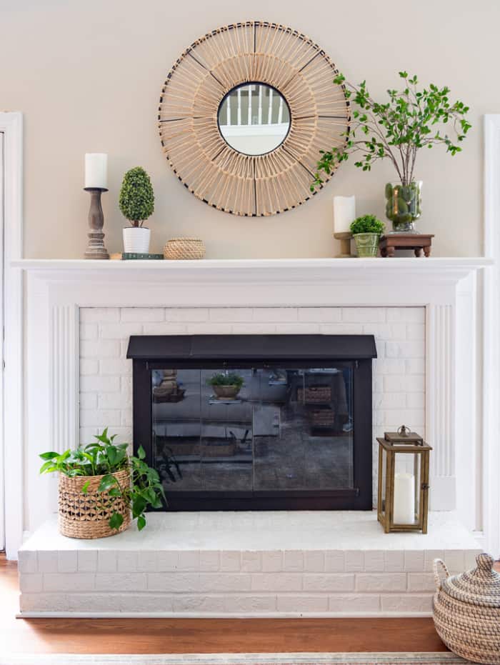 white brick fireplace decorated for spring