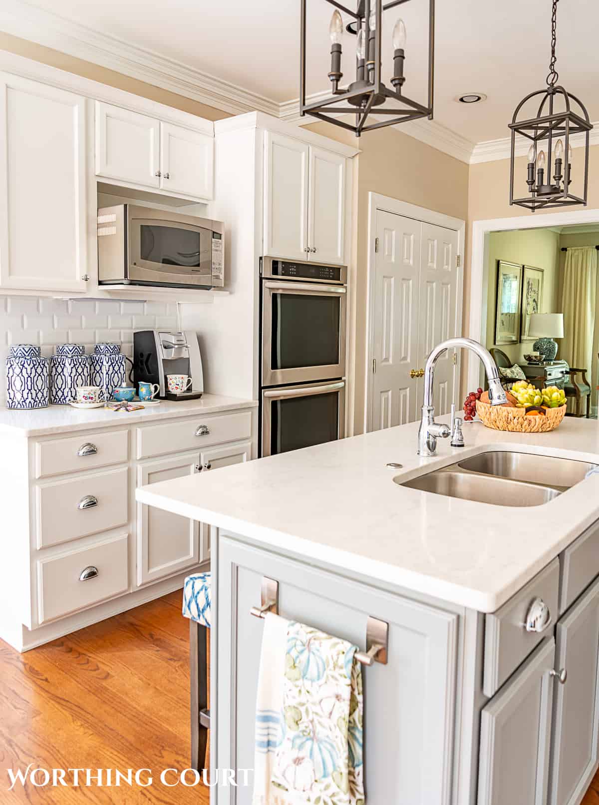 blue and white fall decorations in a kitchen with white cabinets