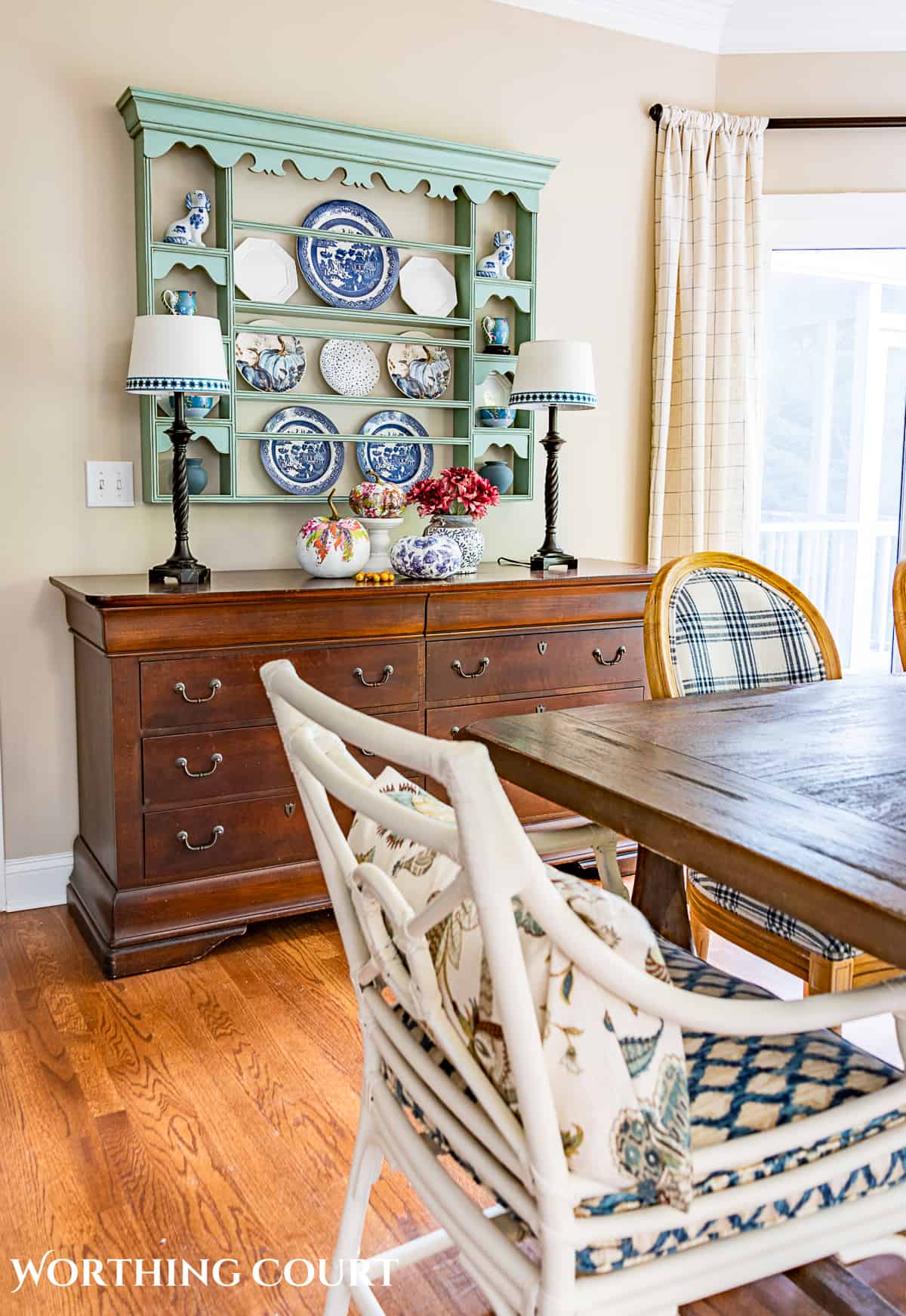 dining room sideboard with plate rack hanging above
