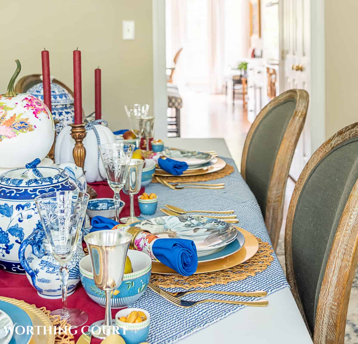 blue and white thanksgiving table setting with touches of burgundy