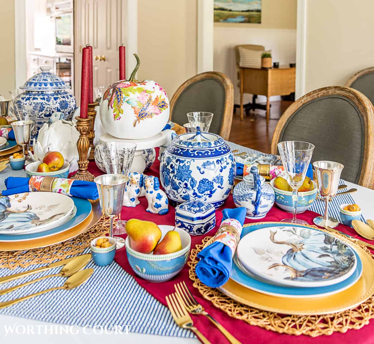 blue and white thanksgiving table setting with touches of burgundy