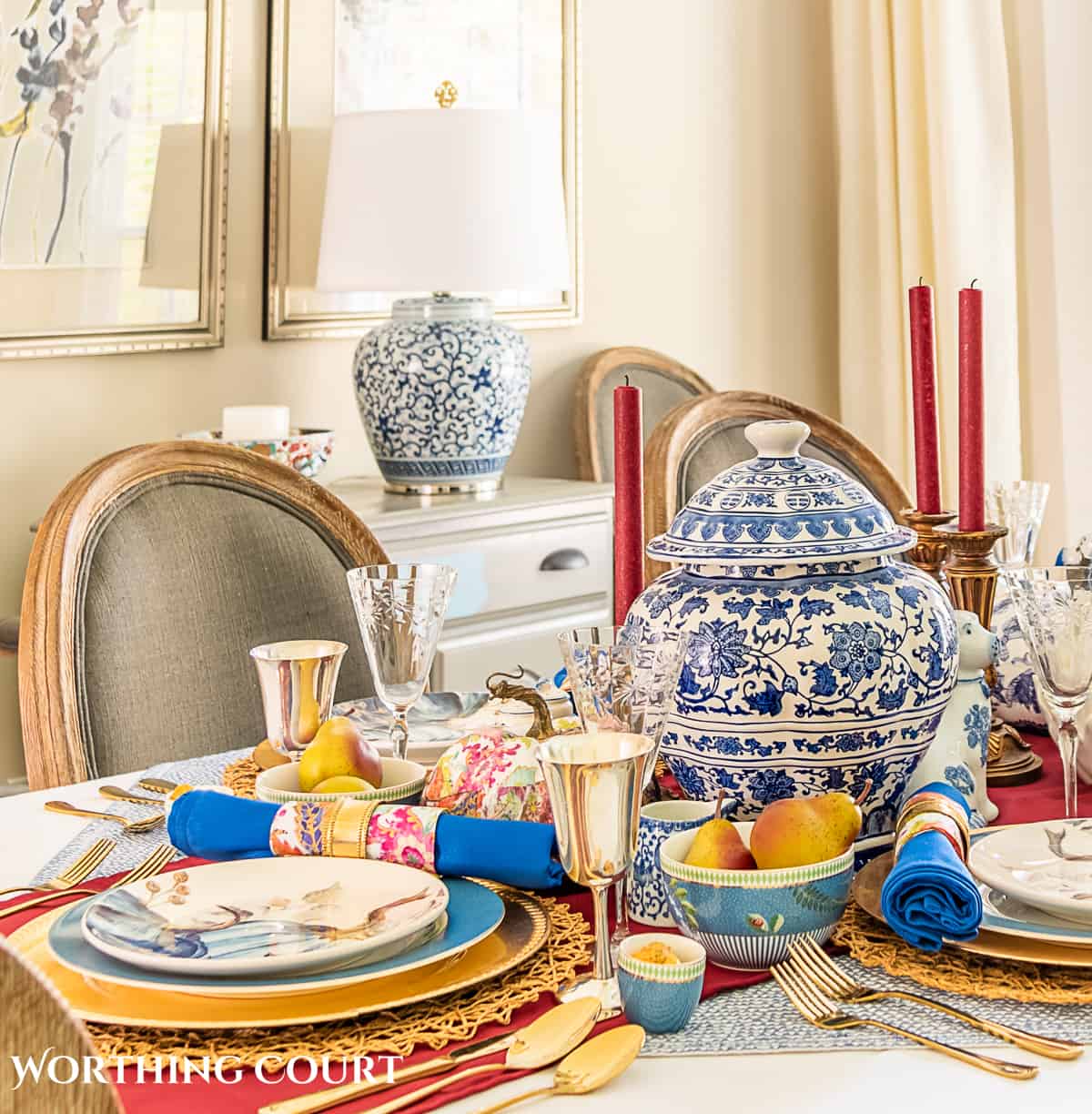 blue and white thanksgiving table setting with touches of burgundy