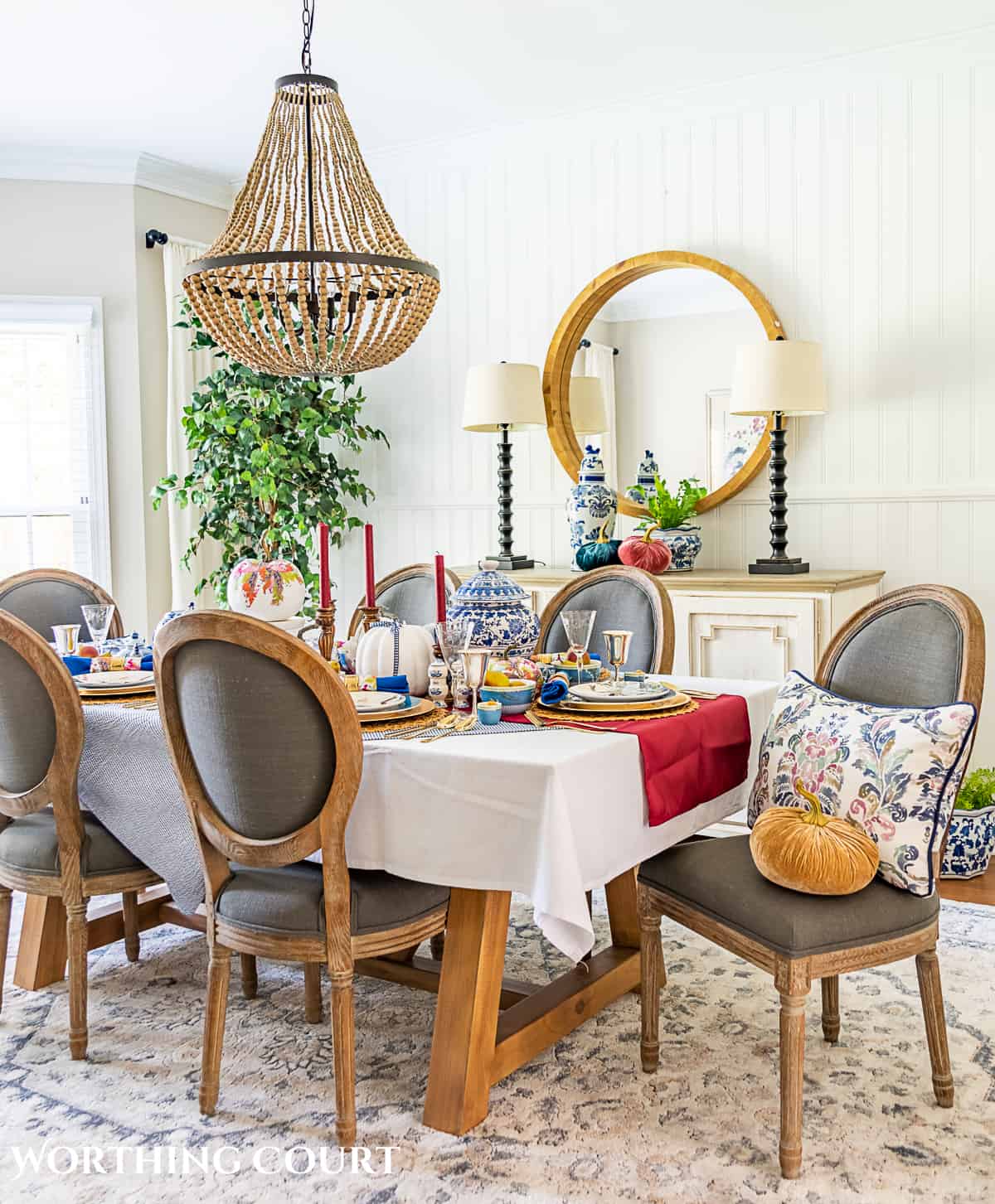 dining room table with gray chairs set for thanksgiving