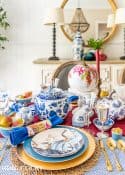 blue and white thanksgiving table setting with touches of burgundy
