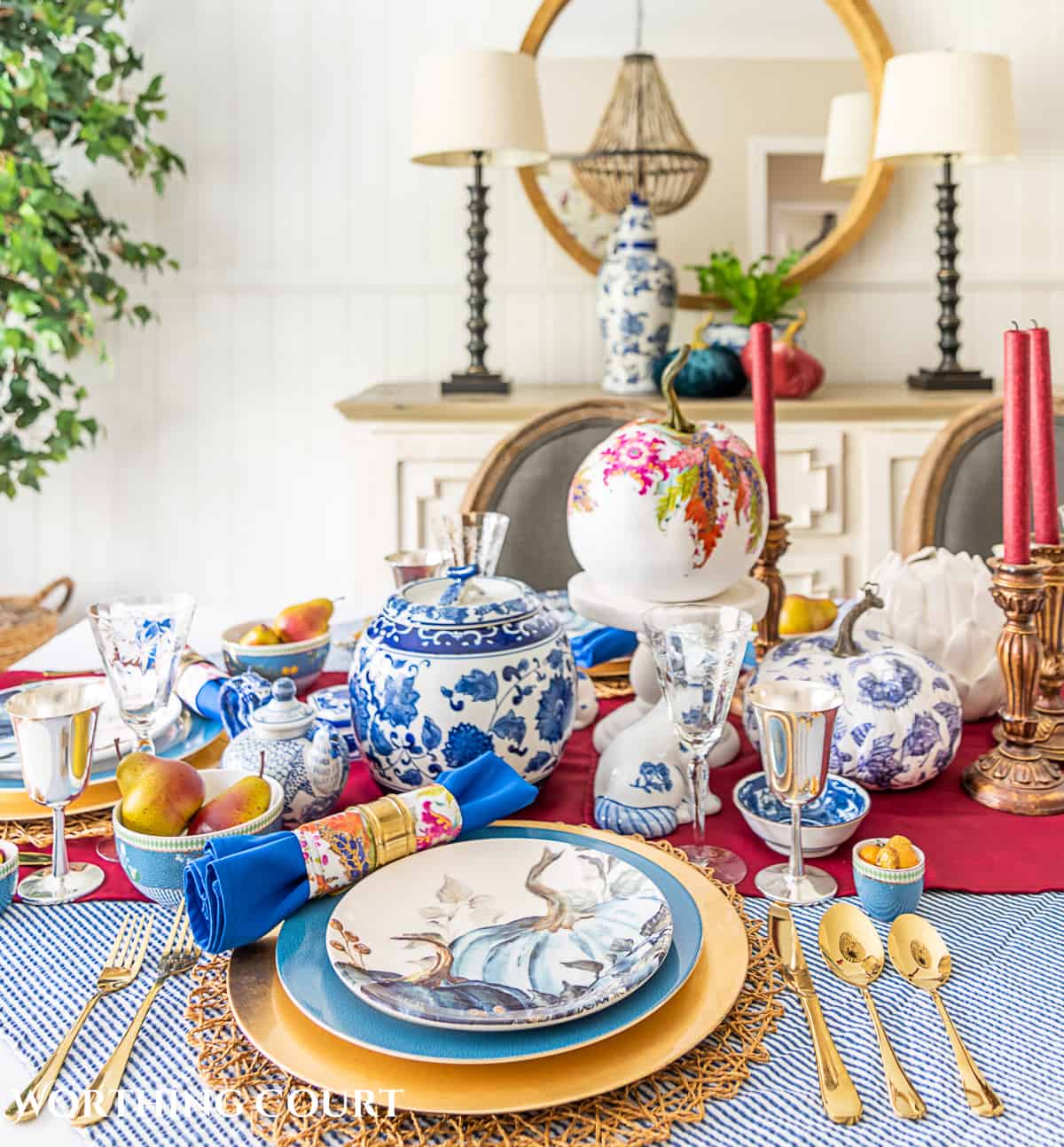 blue and white thanksgiving table setting with touches of burgundy