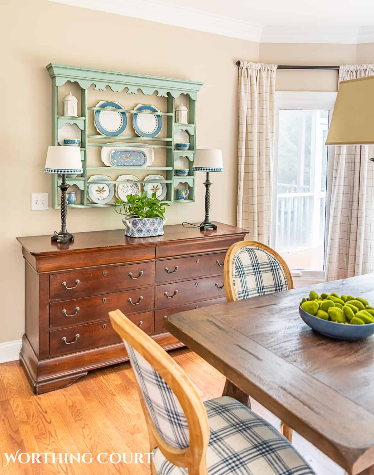 blue plate rack with blue and white dishes and tips for how to decorate a plate display rack with your favorite items