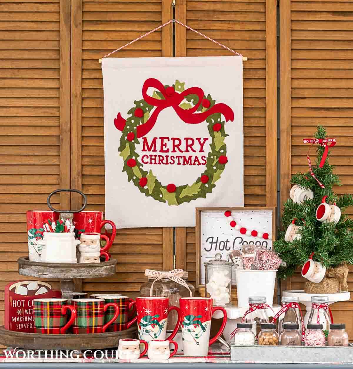 Christmas hot chocolate bar setup on a gray chest