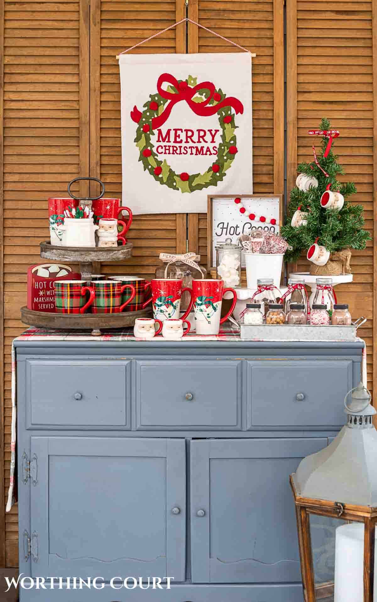 Christmas hot chocolate bar setup on a gray chest