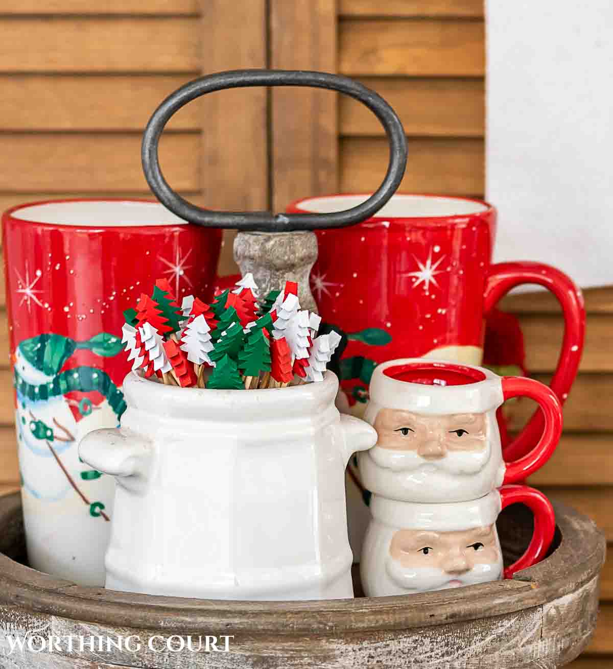mugs and stir sticks on a Christmas hot chocolate stand