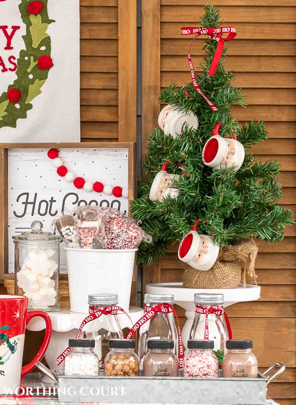 mini Christmas tree and Santa mugs on a hot chocolate bar