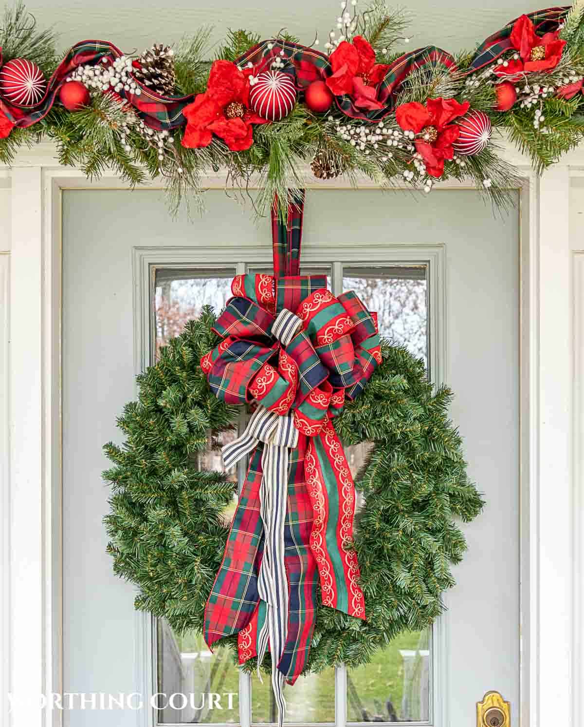 Christmas wreath with red and green ribbon bow