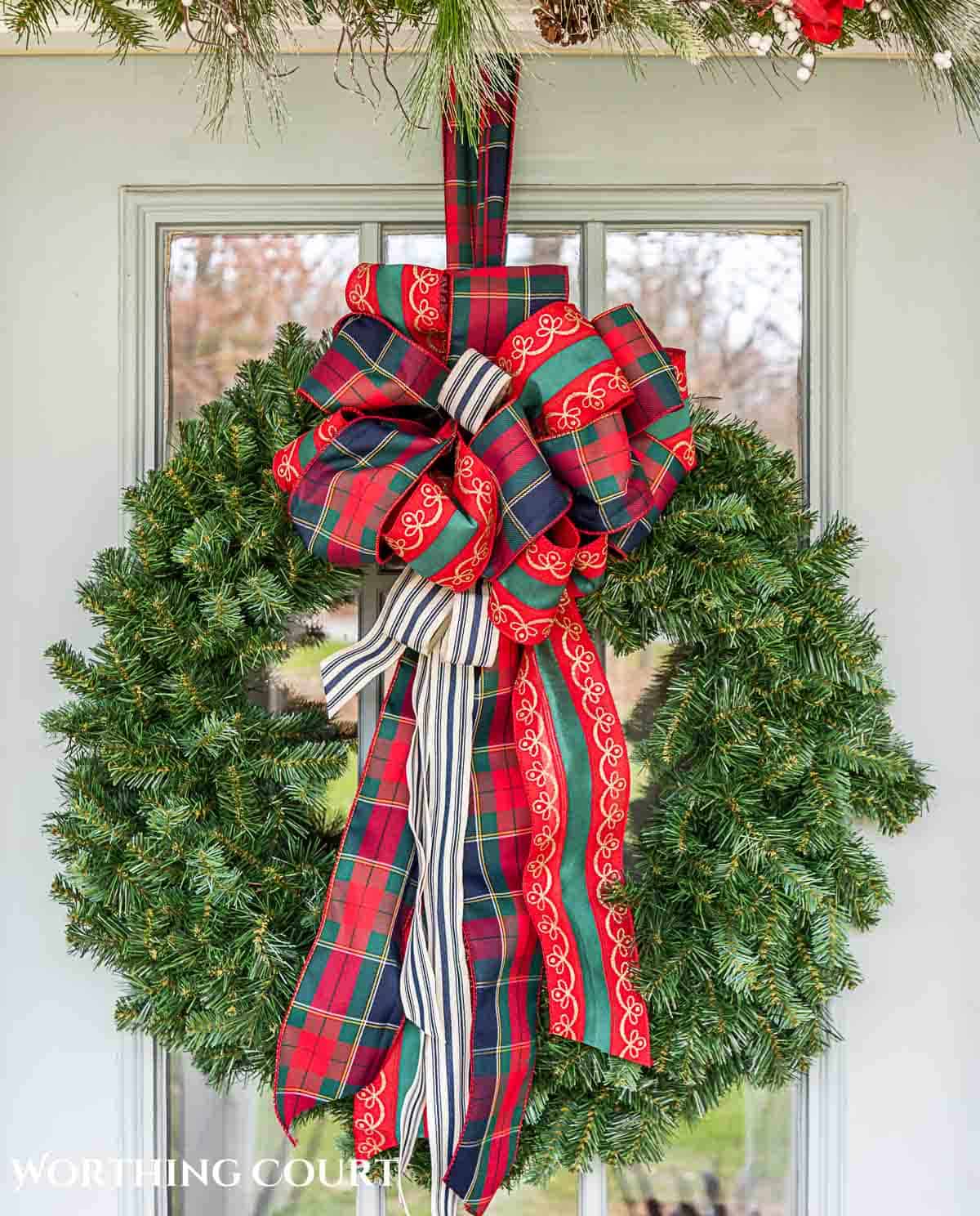 Christmas wreath with red and green ribbon bow