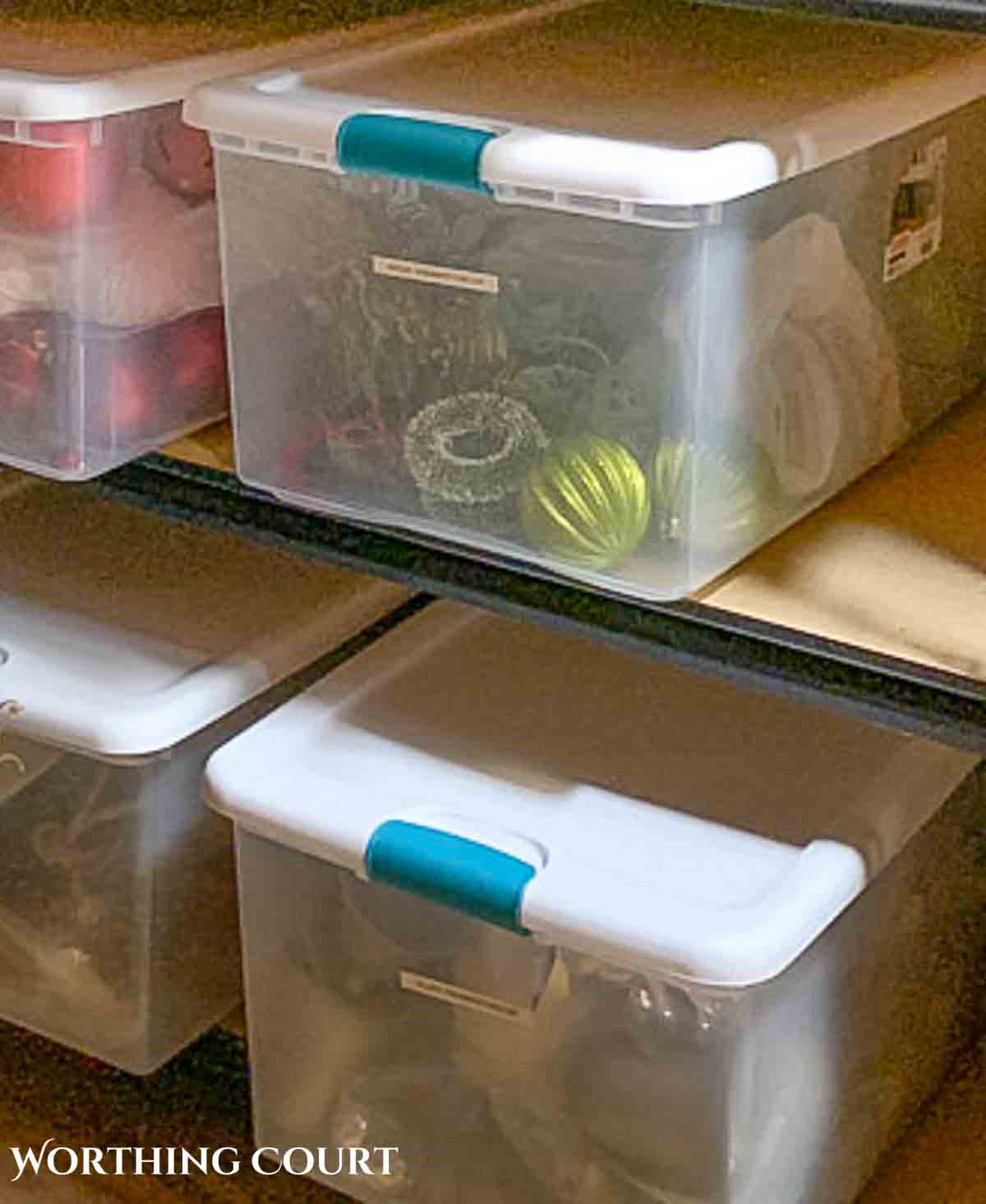 Christmas ornaments stored in a clear box with lid