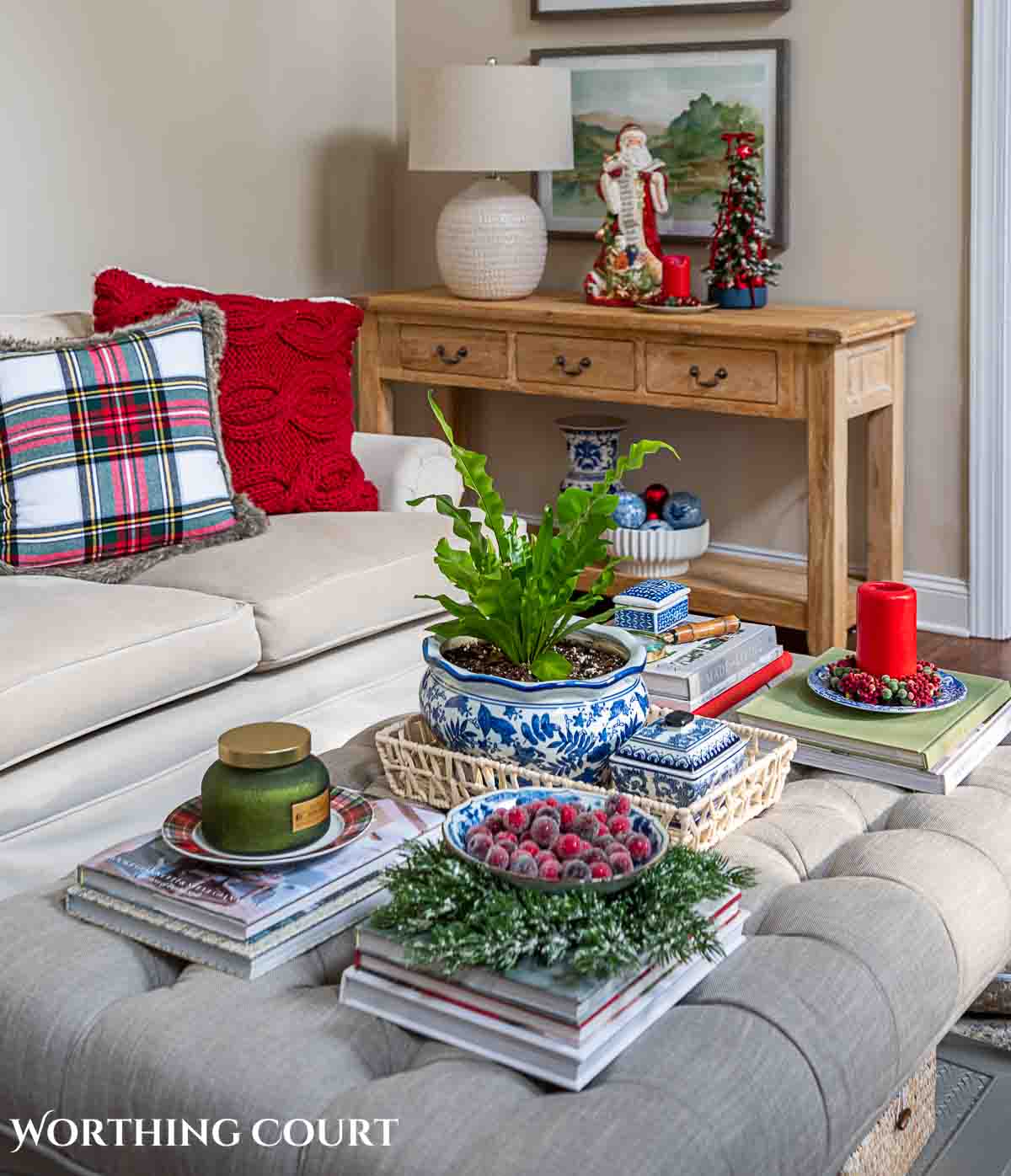 Christmas tree, fireplace and living room decorated for Christmas with red green and gold decorations