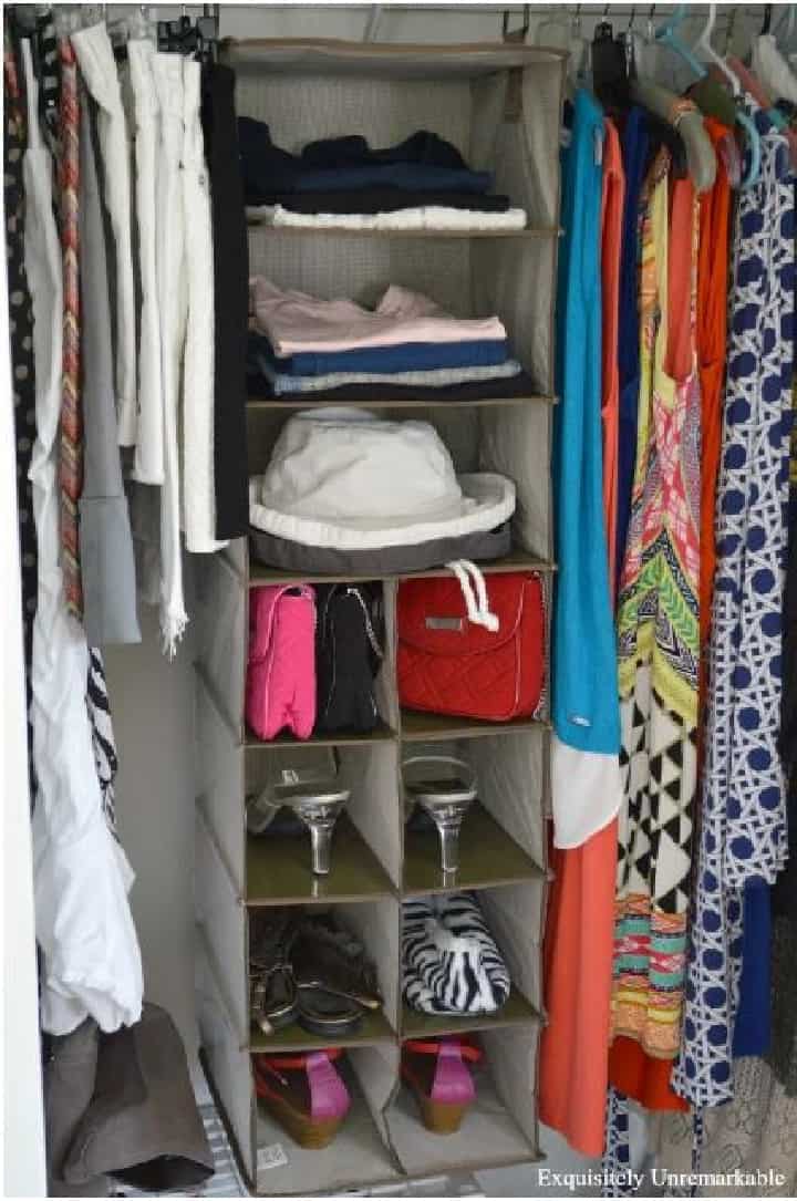 a set of hanging shelves for organizing a small closet