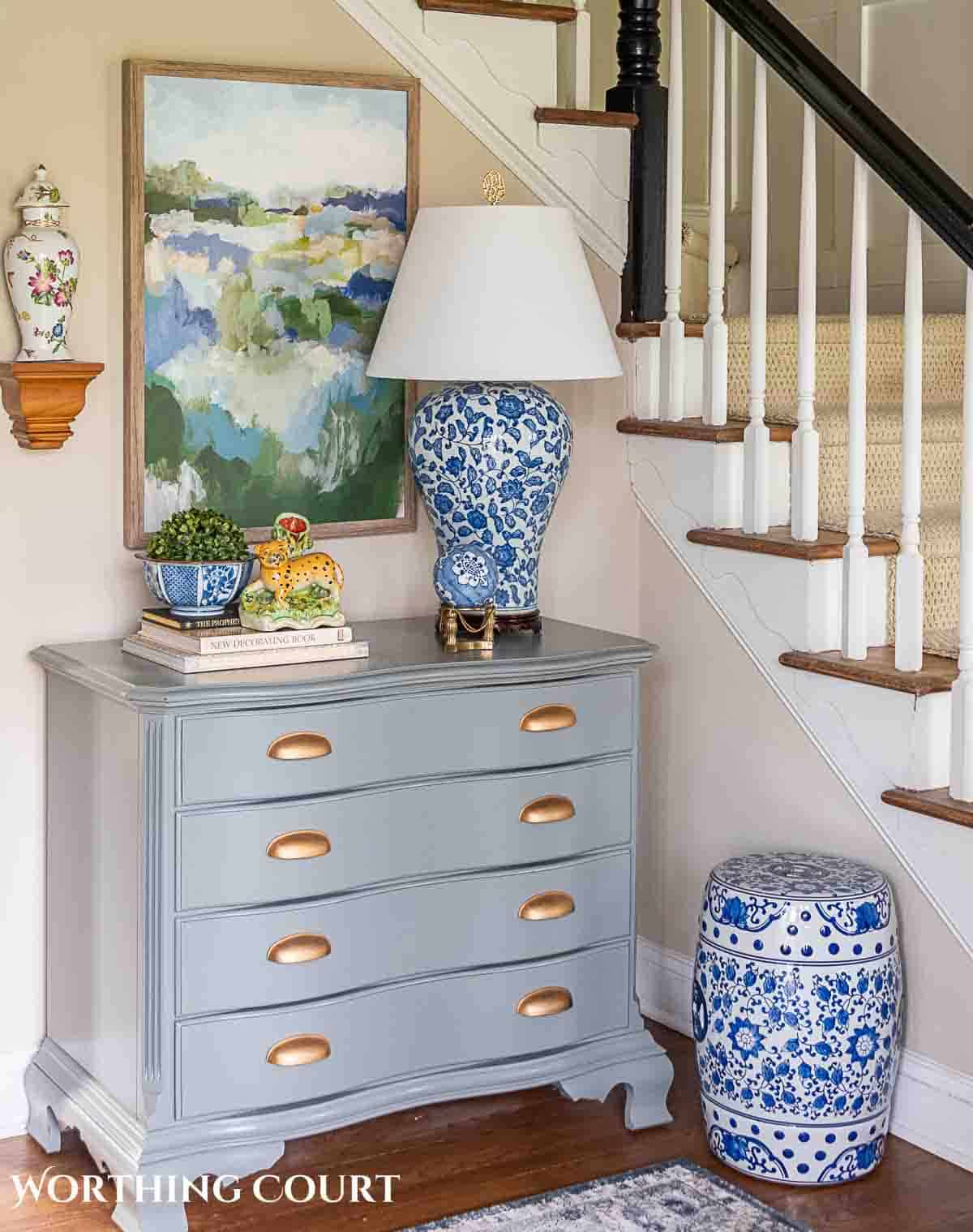 foyer with gray chest and spring decorations and greenery