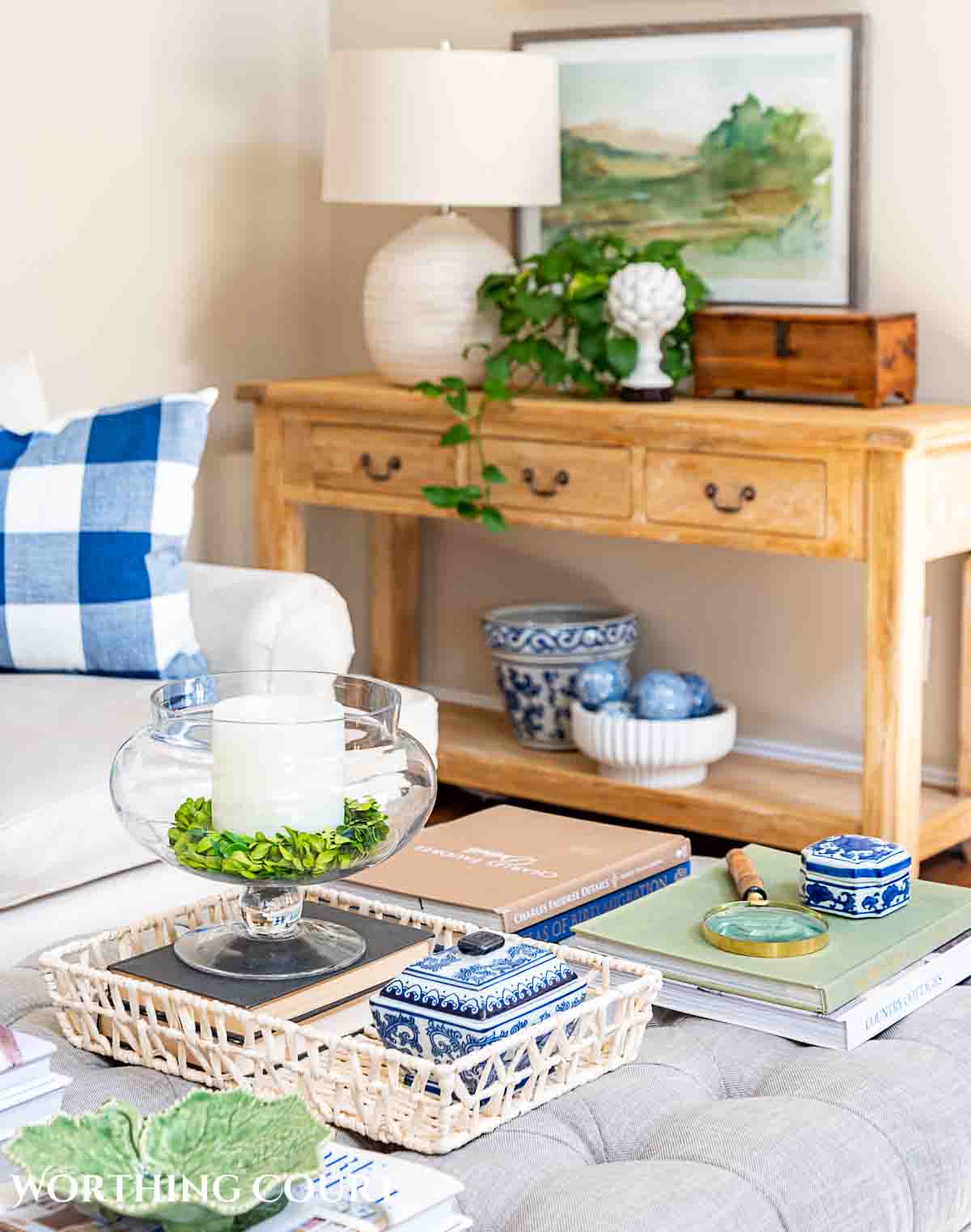 upholstered coffee table decorated with greenery and other accessories for spring