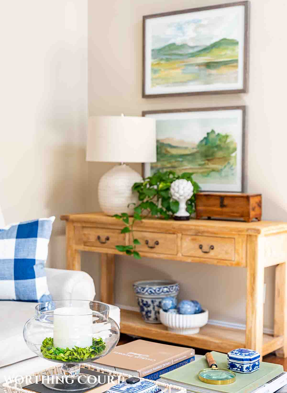 console table decorated with abstract art above it and other accessories