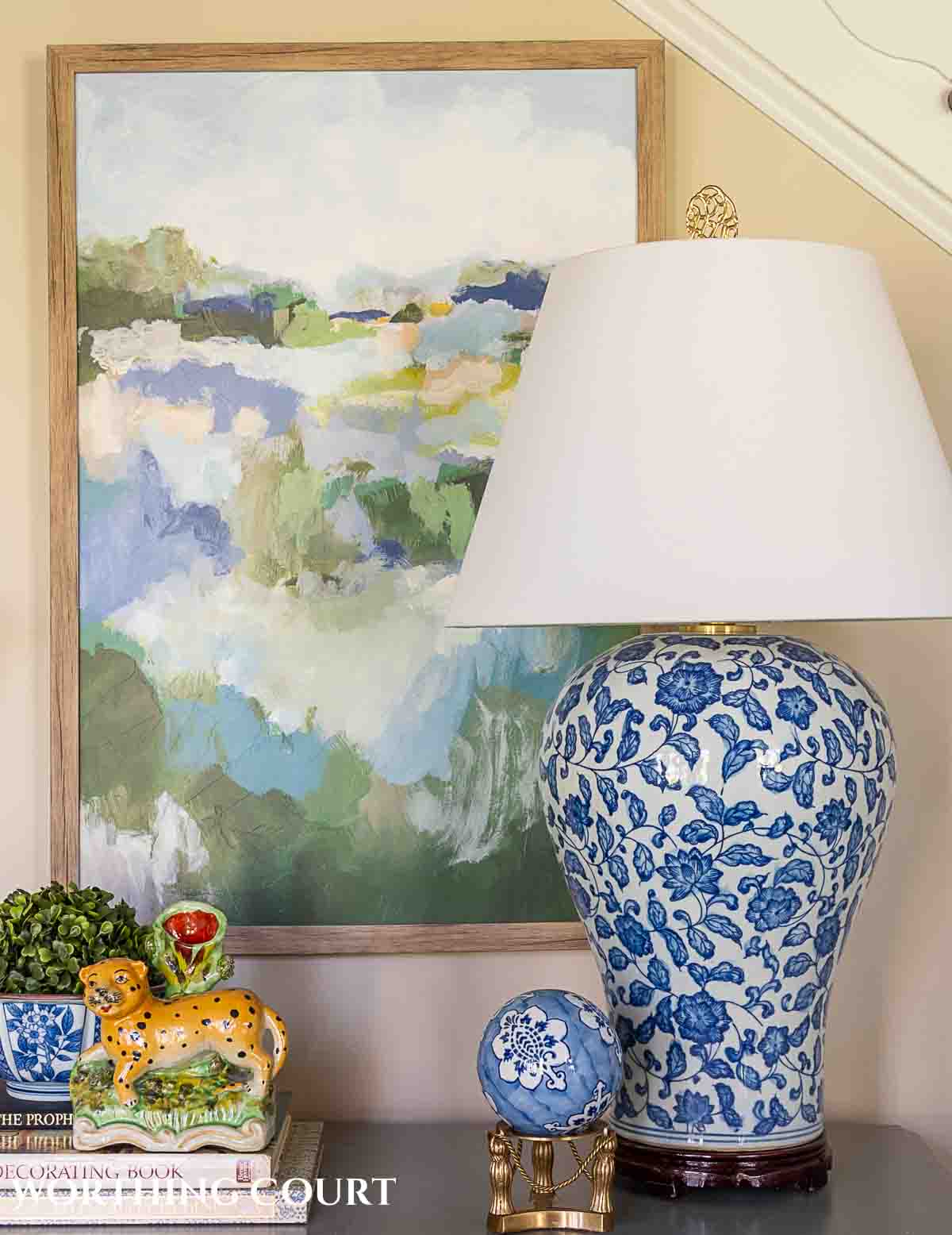 abstract art and blue and white decorations on a foyer table