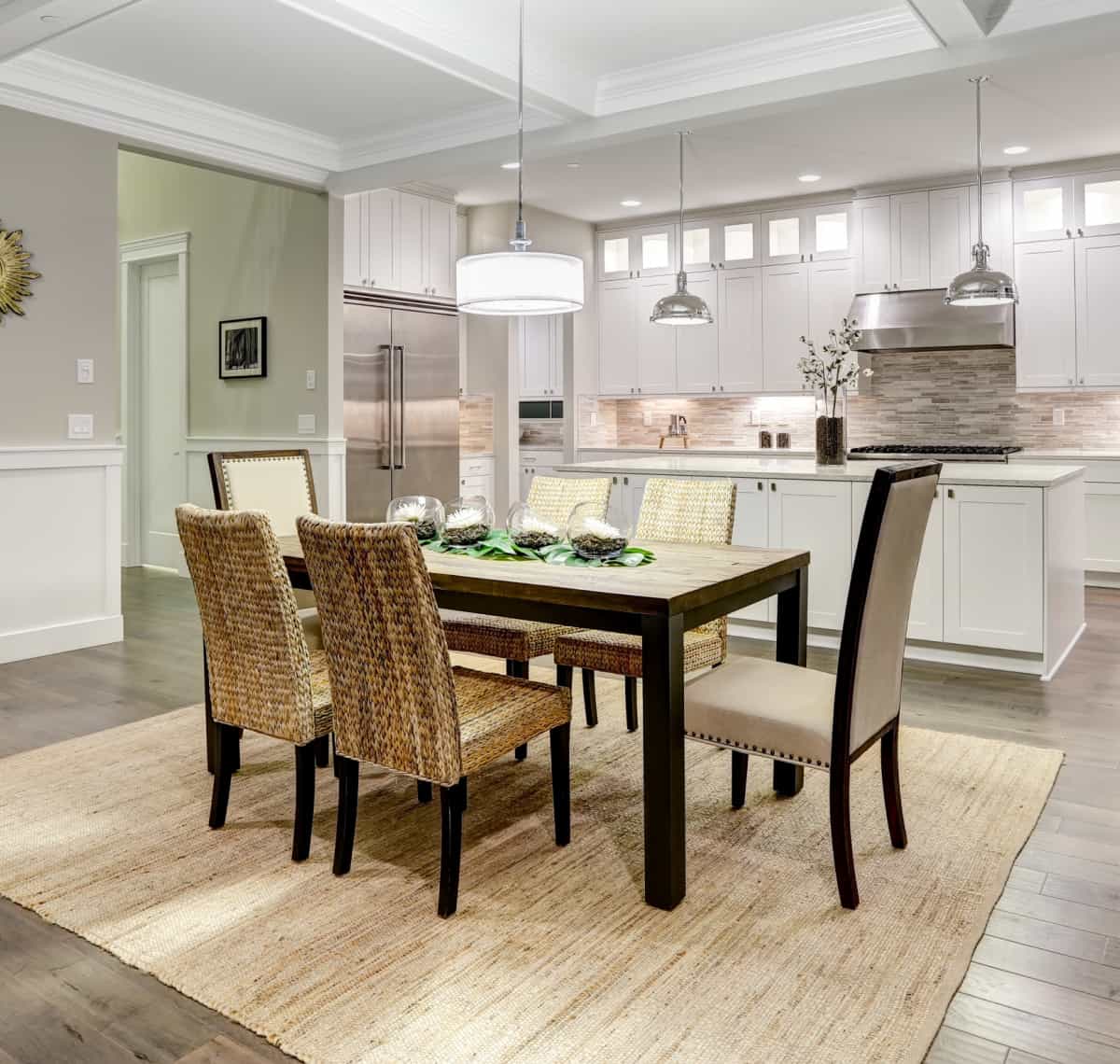 dining table and chairs in a kitchen on a sisal rug