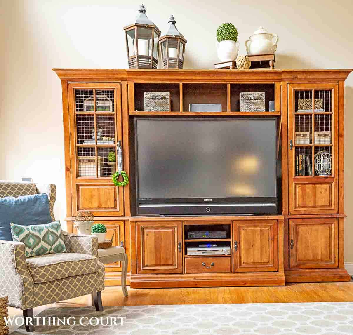 wood entertainment center with decorations