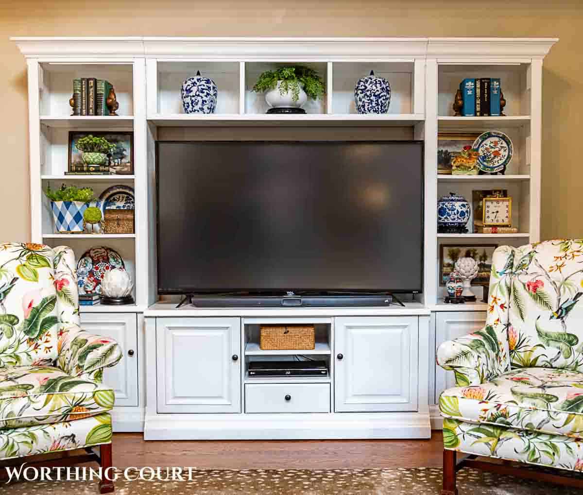 white entertainment center decorated with accessories