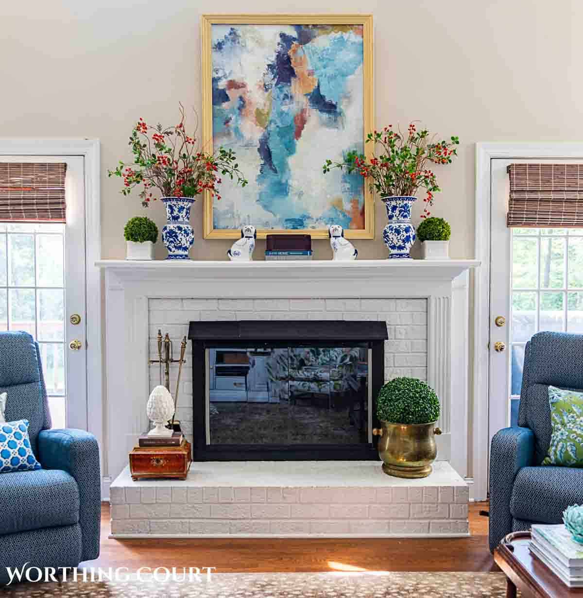 late summer chinoiseries accessories on a fireplace mantel and hearth