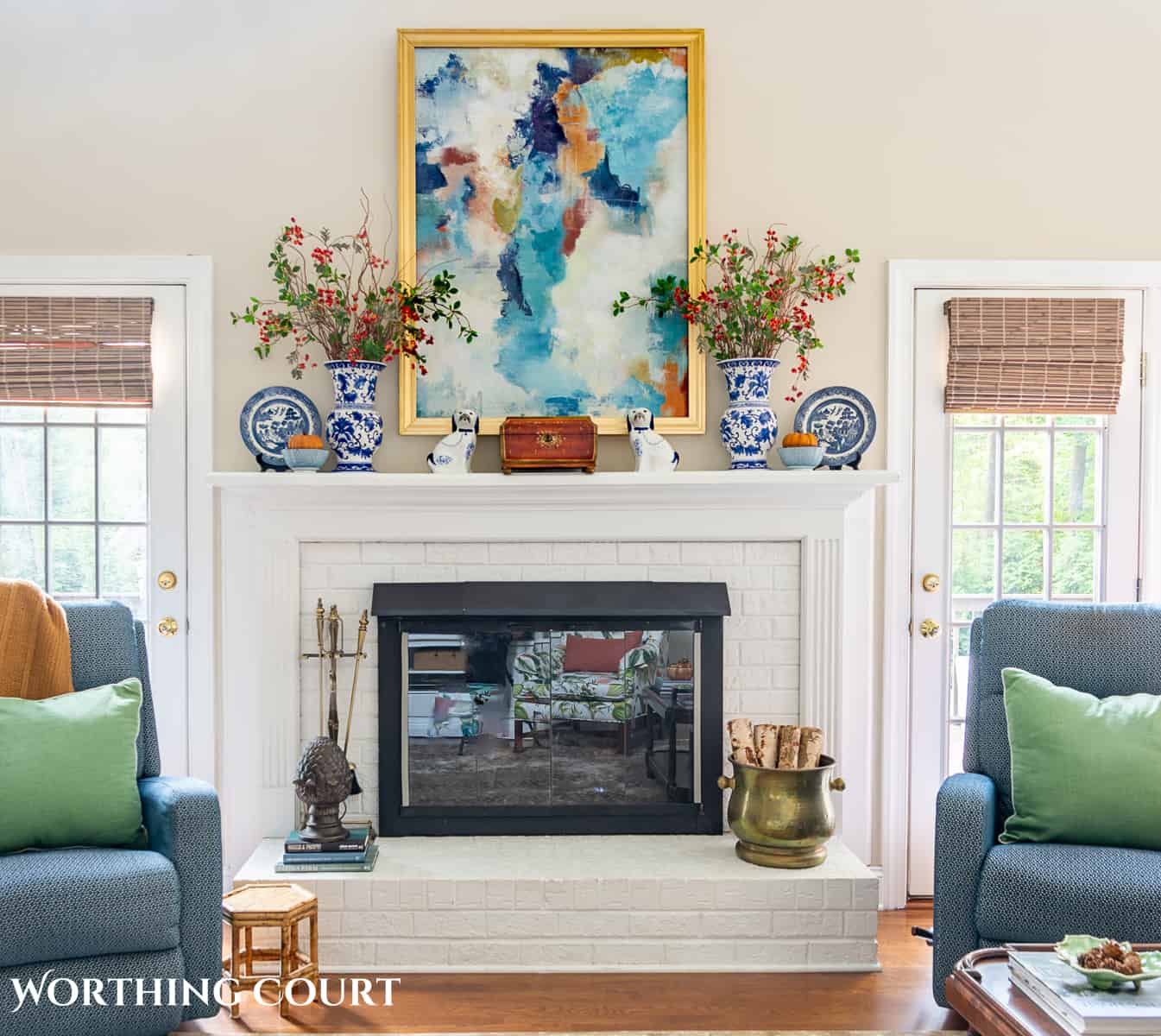 white brick fireplace with blue and white accessories and diy fall decorations