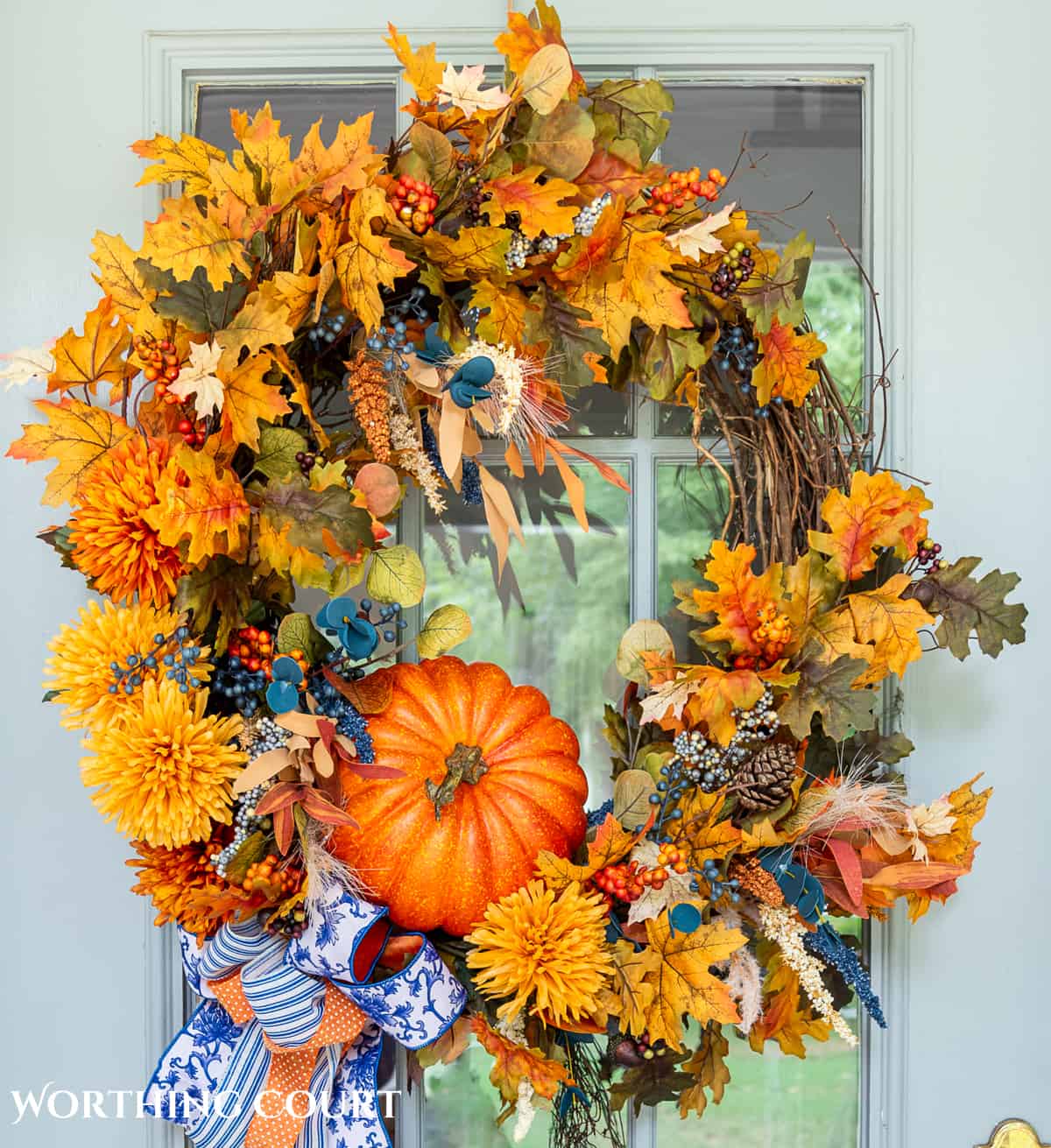 fall front door wreath on a gray door