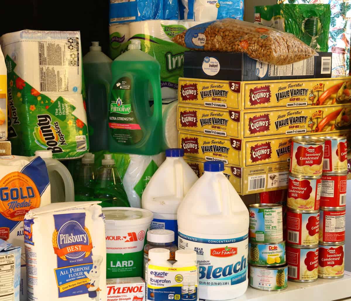 varitety of food and cleaning supplies in a well stocked pantry that has this home ready for the holidays