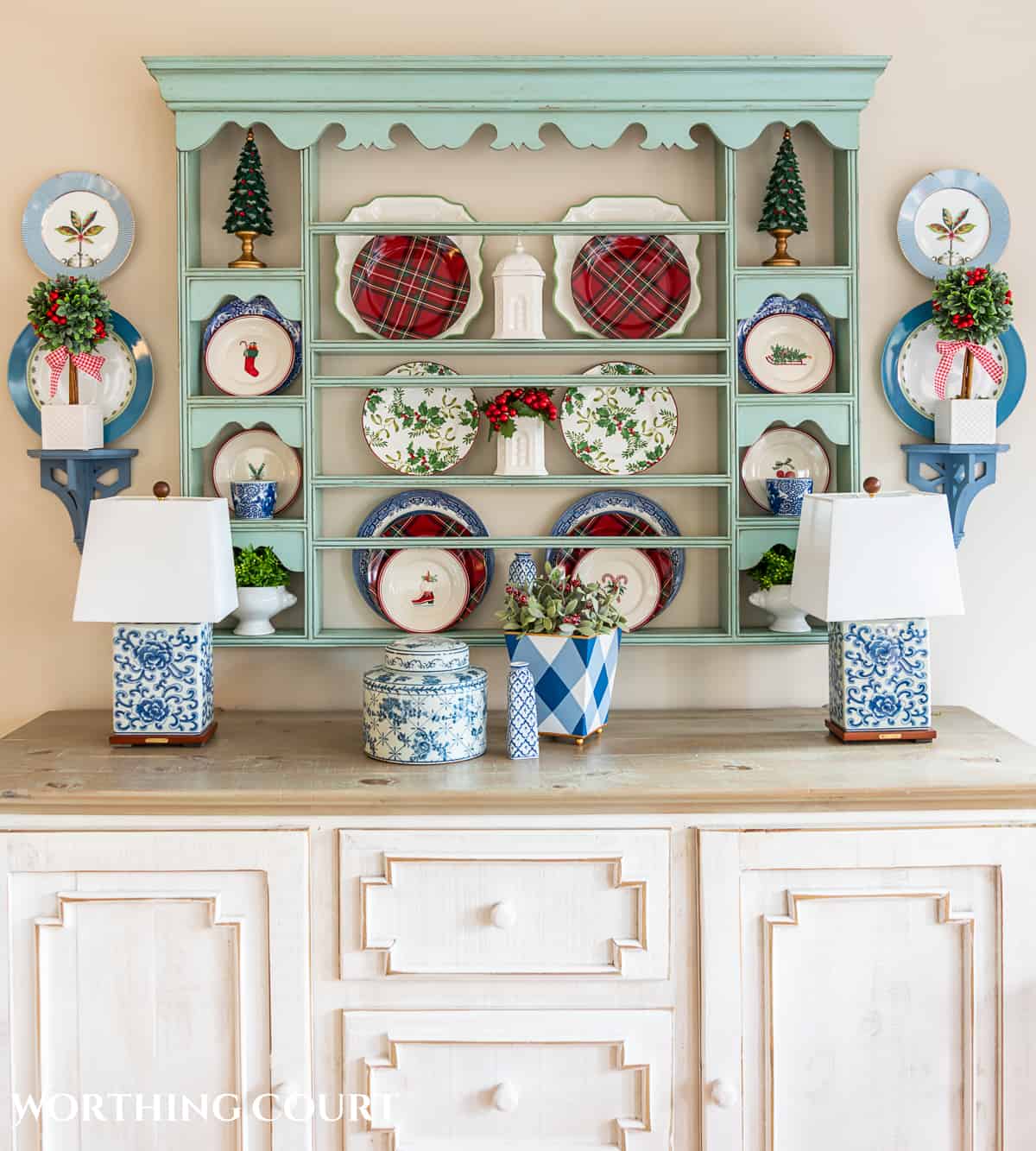 plate rack above a sideboard with Christmas plates and decorations