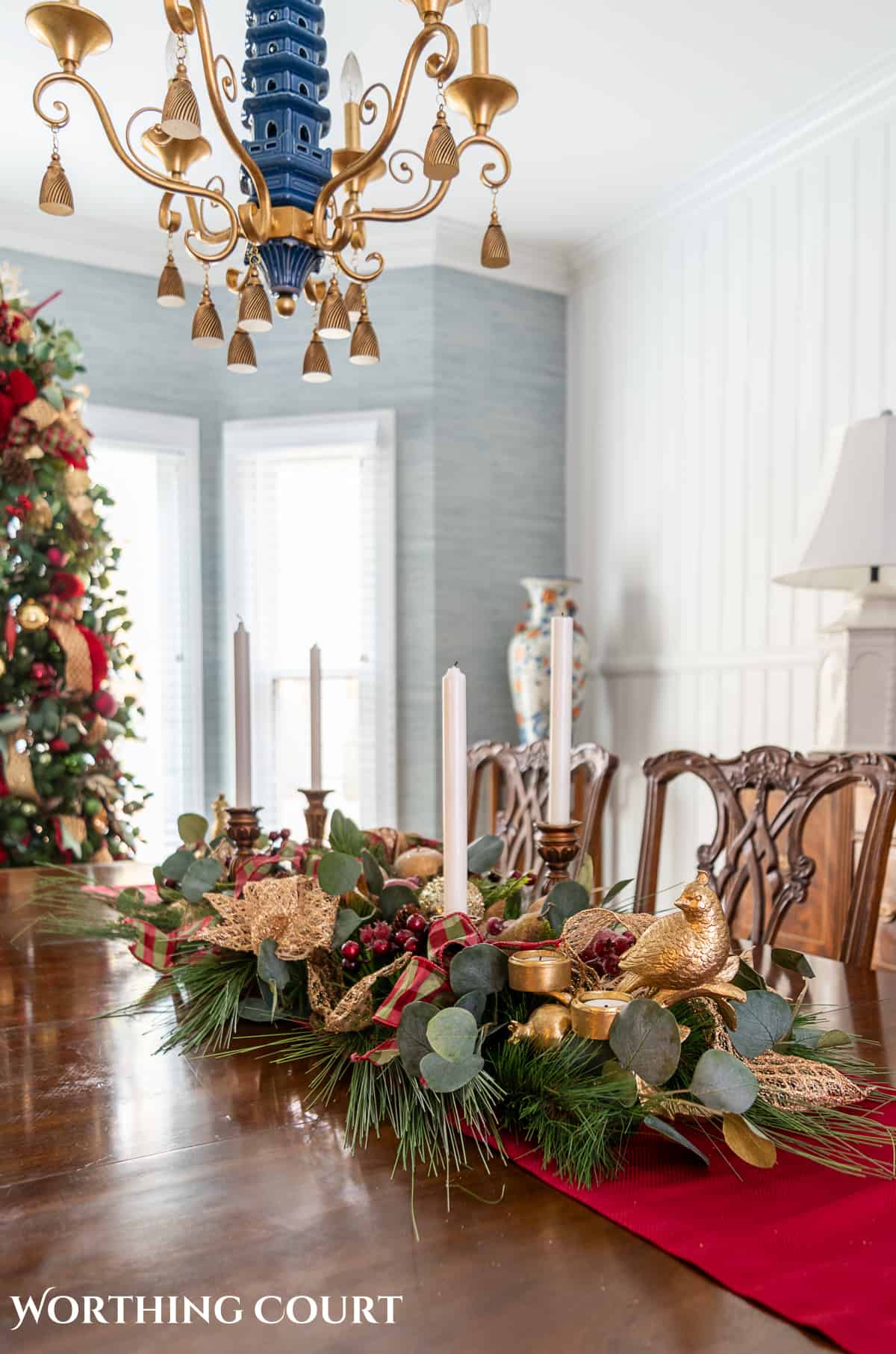 An elegant, but easy Christmas centerpiece made with faux greenery and sugared fruit swags. Includes green, burgundy and gold ribbon, gold candlesticks and white candles.